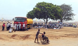 Thousands of people arrive for the outdoor Mass with Pope Benedict XVI.  (CNS photo: Alessandro Bianchi, Reuters) 