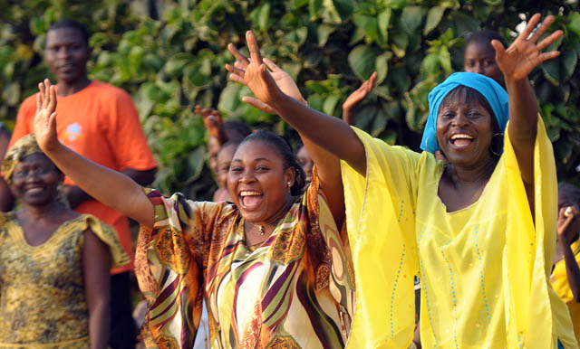POPE-ARRIVE Women cheer as Pope Benedict XVI arrives in Cameroon's capital, Yaounde on March 17. (Photo: Alessia Giuliani, Catholic Press Photo)