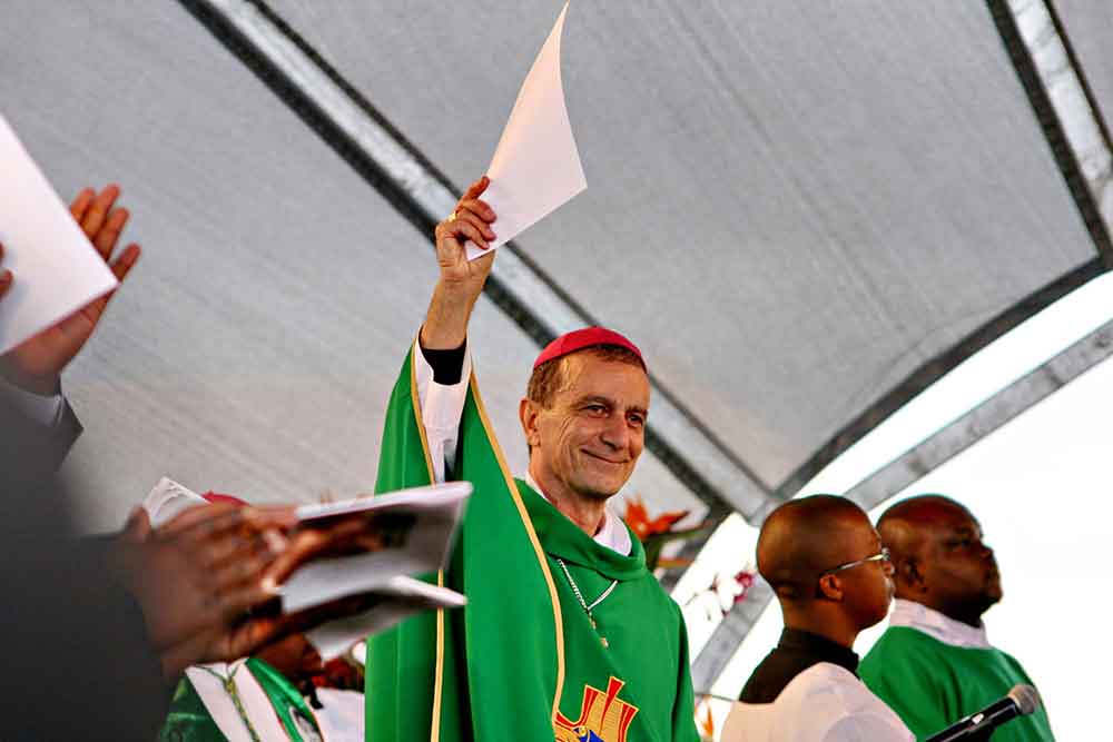 Bishop Joo Rodrigues of Tzaneen holds up the decree of beatification in 2015