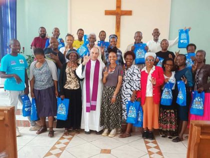 Dominican Father Mark James with some of his Deaf congregants after Mass.