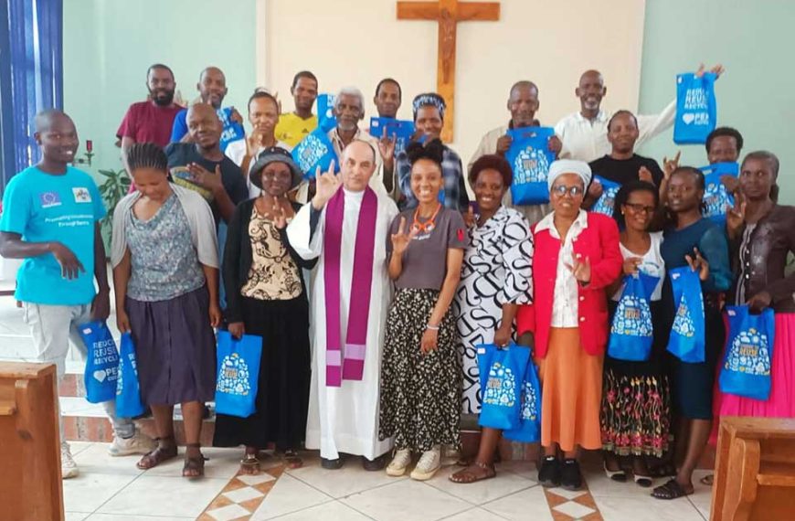 Dominican Father Mark James with some of his Deaf congregants after Mass.