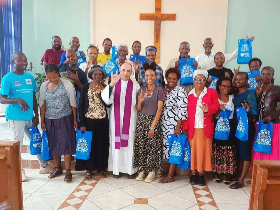 Dominican Father Mark James with some of his Deaf congregants after Mass