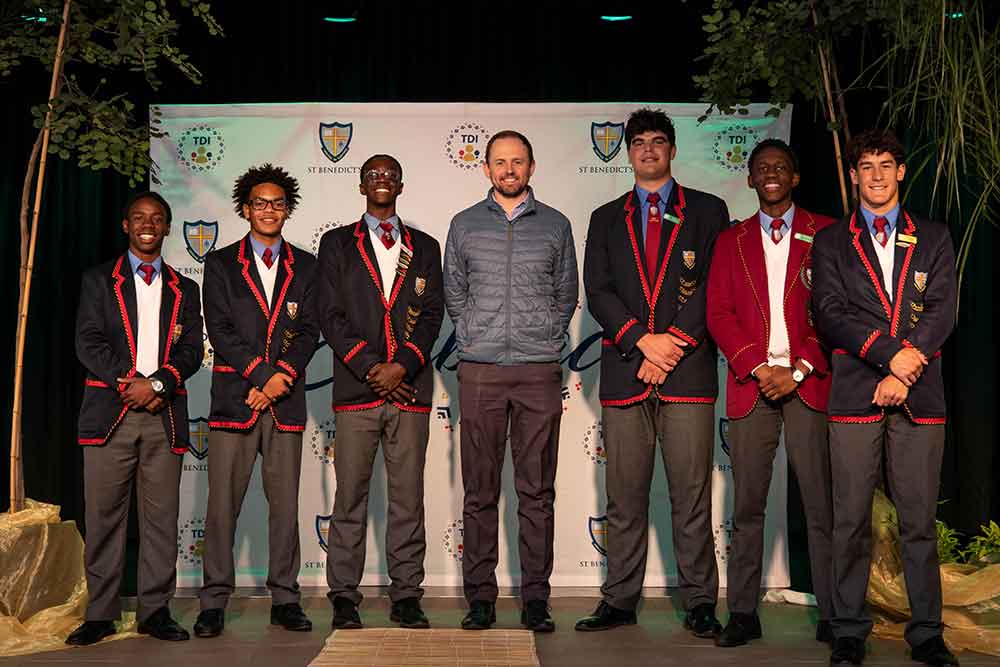 Embrace speaker Chris Harrison with St Benedicts pupils From left  Dominic Changamire Yaseen Diedericks Jaden Mulena Leandro Varonou Bahlebonke Mazibuko Kieran Fish