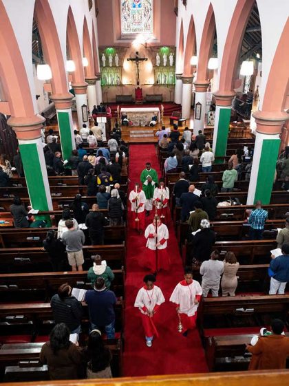 The concluding procession at St Augustine's Cathedral, Diocese of Port Elizabeth, as the congregation remains standing in prayer and song. Photo by Gregory b. Stephenson