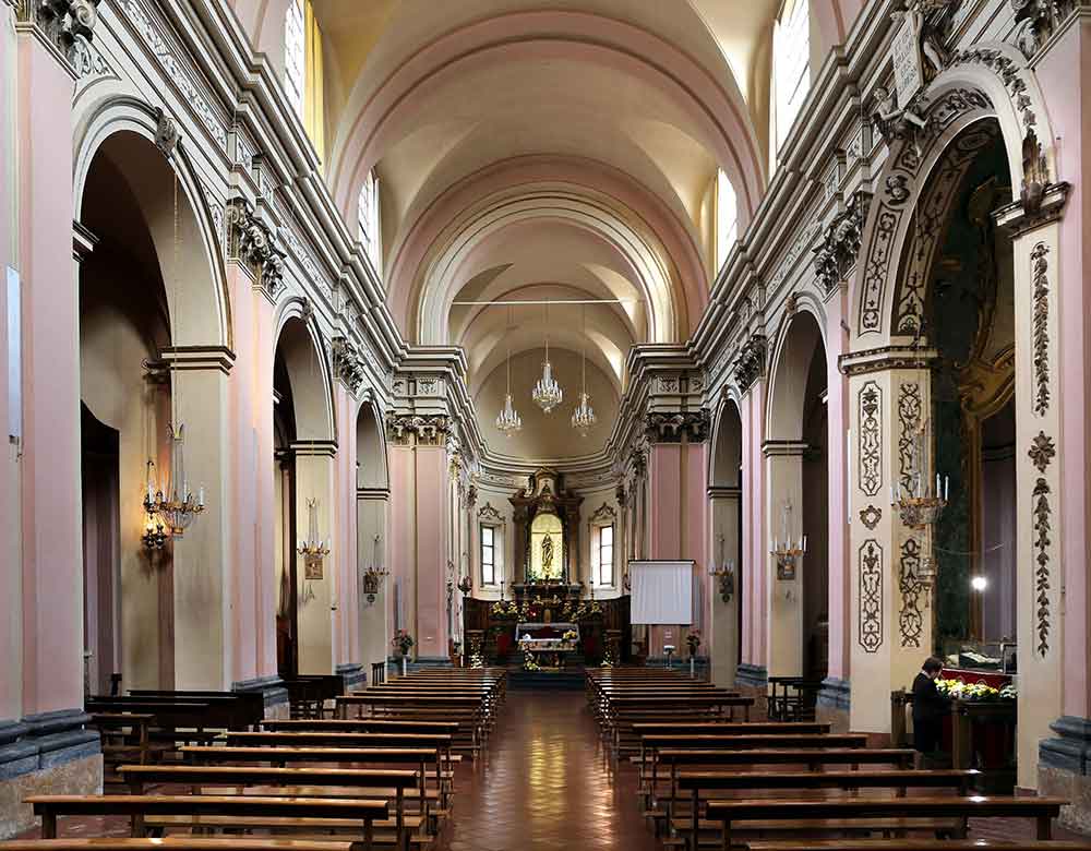St Peregrine basilica in Forli with a woman praying at the saints tomb at bottom right
